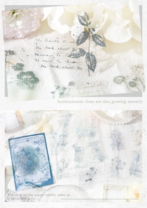 Close-up of vintage floral PET stickers with handwriting on white fabric background