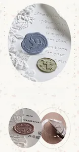 Macro view of vintage sealing wax stickers featuring 3D embossed cupid and angel patterns