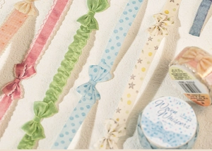Detail of Woven Whispers washi tape featuring bow designs for DIY planners and crafts