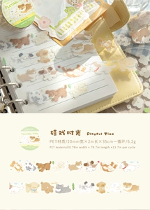 Detail of PET decorative tape featuring playful cartoon dogs on a creative journal page