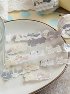 Detail of 15mm PET decorative tape featuring cute cartoon dog illustrations for scrapbooking