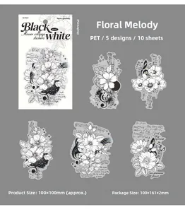Détail macro d'autocollants floraux vintage noir et blanc en PET pour scrapbooking