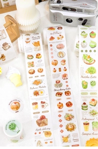Macro detail of washi tape featuring hand-drawn coffee and dessert illustrations