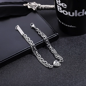 Detail view of double-layer stainless steel heart bracelet with engravable metal tag