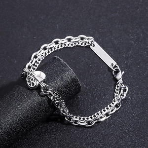 Silver double-layer stainless steel heart bracelet featuring curb chain and heart pendant
