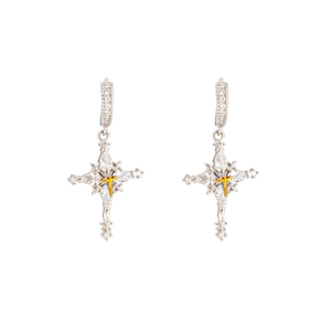 Silver and gold cross drop earrings with clear zircon stones on a white background