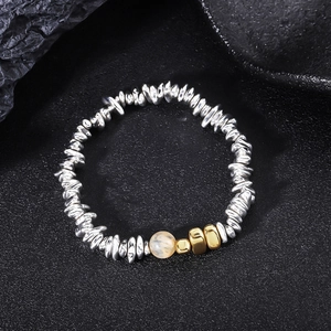 Modern hematite beaded bracelet with silver textured beads and a yellow gemstone