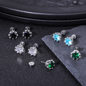 Detail view of crown-set cubic zirconia studs in black, white, blue, and emerald green
