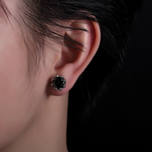 Men's crown black zircon stud earring in silver setting shown on model's ear