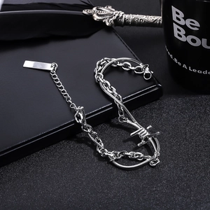 Punk style silver double-layer chain bracelet featuring barbed wire element and tag