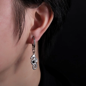 Seahorse pendant earring in silver stainless steel with black stone on a male model