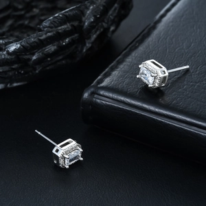 Macro detail of rectangle cubic zirconia halo earrings in polished silver finish