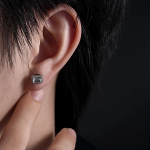 Square silver stud earrings with rectangle-cut zircon and pave-set crystals on model