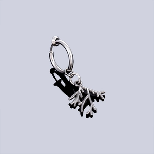 Silver stainless steel ear clip featuring a leaf-shaped twig pendant with a polished finish