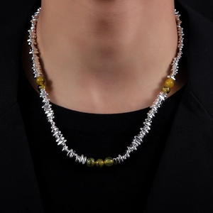 Unisex silver metallic beads and amber-toned gemstone necklace on a black suit