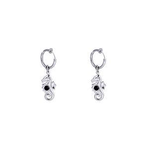 Polished stainless steel seahorse earrings with black gemstones on white background