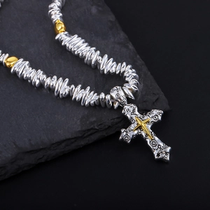 Cross pendant necklace with silver textured beads and engraved Peace cross charm
