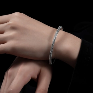 Minimalist silver stainless steel multi-layer bracelet with textured geometric patterns