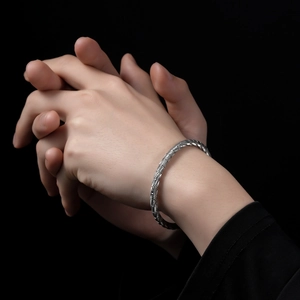 Silver woven rope texture open cuff bracelet in stainless steel for a sleek metal look