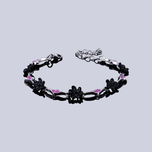 Gothic silver alloy chain bracelet with black cross floral charms and pink enamel accents
