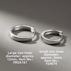 Detailed view of silver hoop earrings in 9mm and 12mm sizes for men on grey surface
