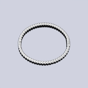 Detailed macro shot of silver bead cuff bracelet with secure plug-in side clasp closure