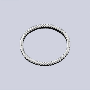 Polished silver textured beaded stainless steel bangle with a secure clasp closure