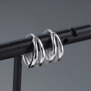 Minimalist S925 sterling silver triple-line hoop earrings for men on jewelry stand