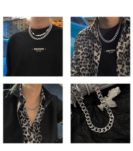 Detail of silver cuban chain necklace with pearl accents for streetwear punk style