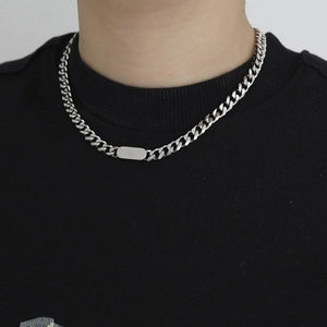 Mens titanium steel Cuban link necklace with polished rectangular bar pendant on black tee