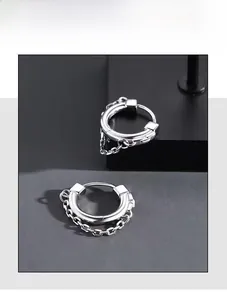 Close-up of silver S925 sterling silver hoop earrings with vintage thick link chains
