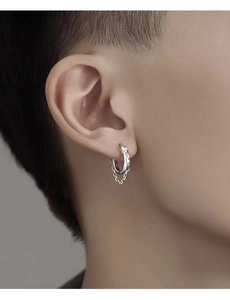 Detail of silver hoop earring for men featuring a double chain drop and polished finish