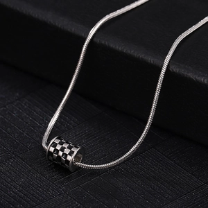 Minimalist checkerboard cylinder pendant on a sleek snake chain for men and women