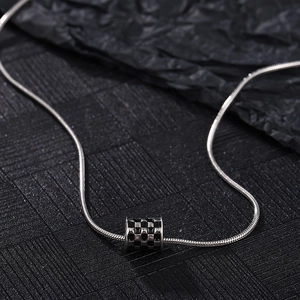 Silver snake chain necklace with black checkerboard cylinder pendant for men