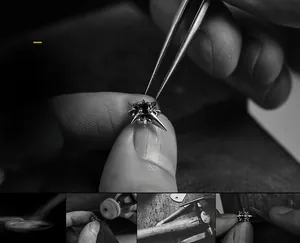 Macro shot of silver North Star stud earring with dark zircon being handcrafted