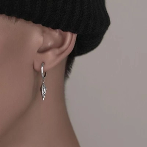 Unisex silver cone pendant earrings with vintage texture on a hoop in punk streetwear style