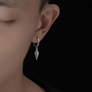 Silver retro textured conical pendant earrings featuring minimalist hip-hop design on model