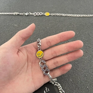 Bracciale a catena argento con strass viola e ciondolo a faccina gialla sorridente
