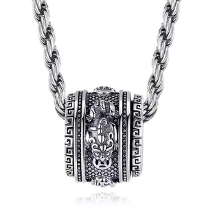 Detail of silver scorpion pendant with geometric patterns and braided rope chain