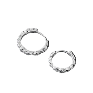 Minimalist silver irregular textured hoop earrings for men in a polished metallic finish
