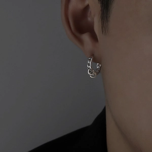 Men's silver chain link hoop earrings with double ring pendants worn on ear