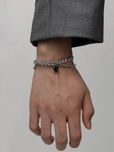 Detail of double-layer titanium steel bracelet featuring a rectangular black gemstone