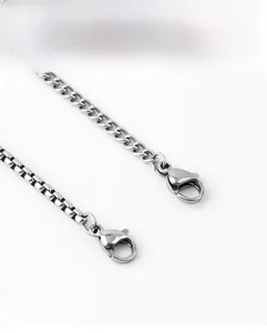 Detail of silver stainless steel curb and box chains with durable lobster clasps