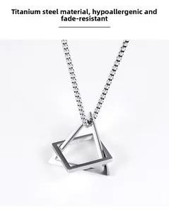 Close-up of titanium steel geometric square and triangle pendant with box chain