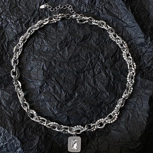 Hip hop silver chain necklace with square zircon pendant on black background