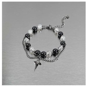 Detail of double-layer beaded bracelet with ice-crack beads and gothic star pendant
