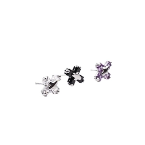 Ensemble de trois boucles d'oreilles étoiles et croix en zircons blanc, noir et violet
