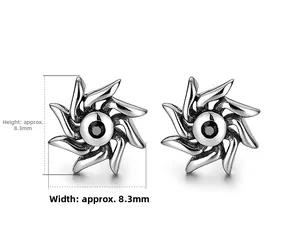 Detail view of silver sunburst earrings with black gemstone, size 8.3mm x 8.3mm
