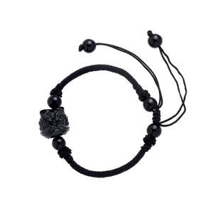 Handcrafted black braided lion bracelet with adjustable cord and lucky charm beads