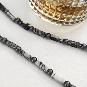 Minimalist marble stone beaded necklace with polished grey metallic beads and hip-hop style